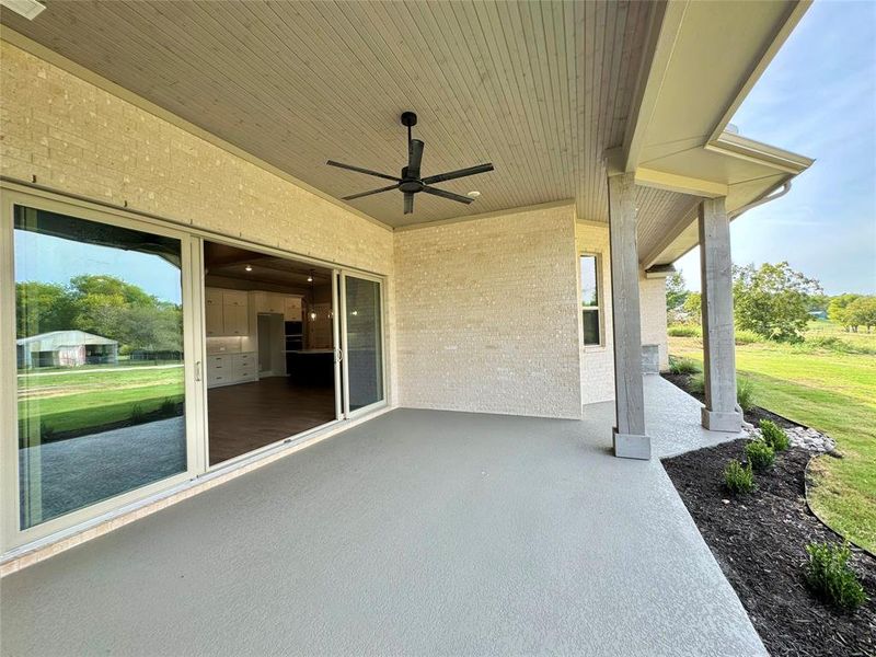 View of patio featuring ceiling fan