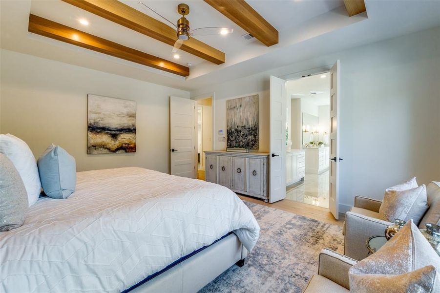 primary bedroom features trayed ceiling with beams