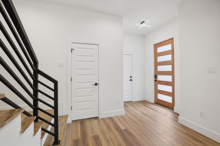 Spacious entryway with upgraded light fixture