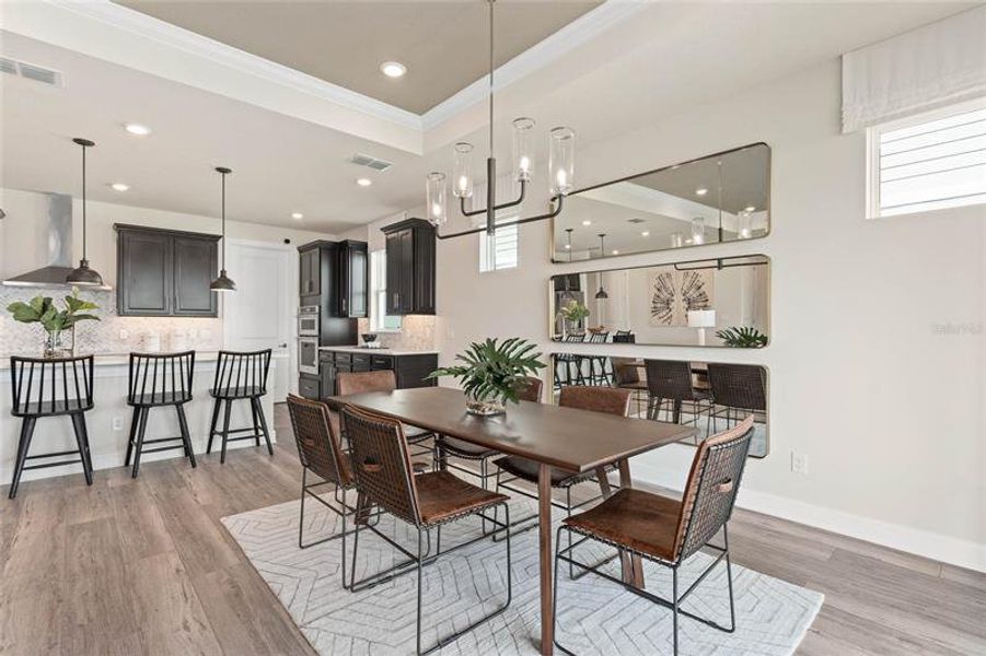 Cafe and Kitchen. Model Home Design. Pictures are for illustrative purposes only. Elevations, colors and options may vary. Furniture is for model home staging only.
