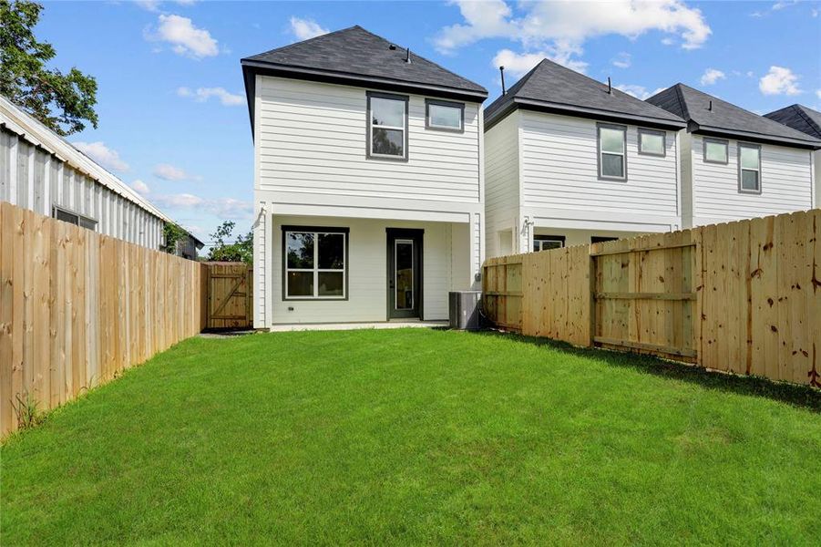 The huge back yard is fully fenced.