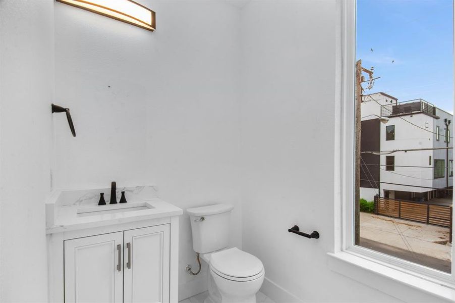 Bathroom featuring vanity and toilet