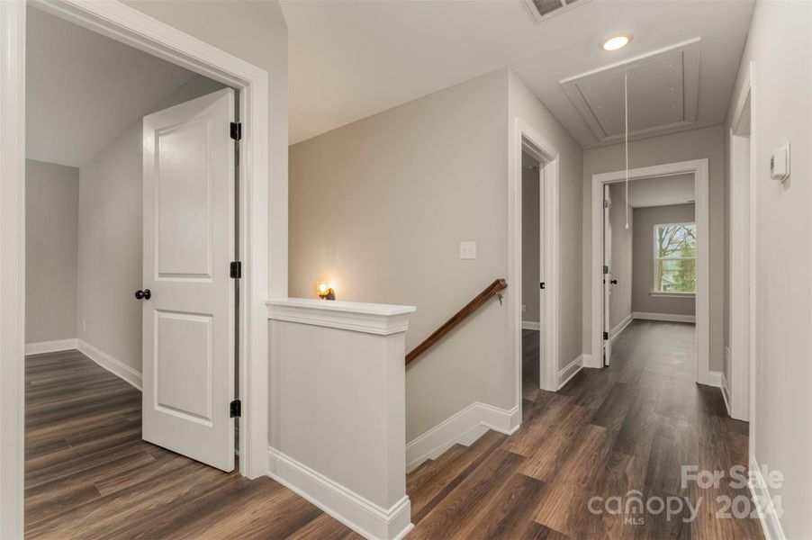 Large hallway with LVP flooring throughout the upstairs.