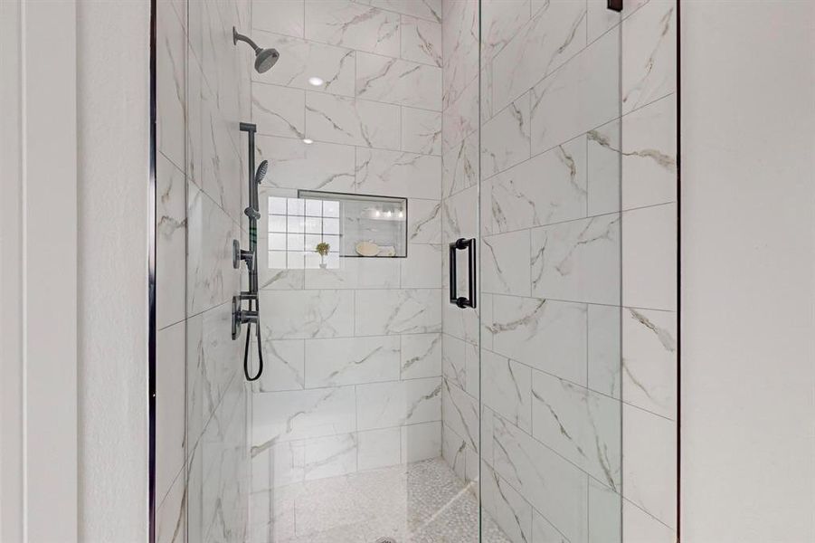 Bathroom with a shower with door