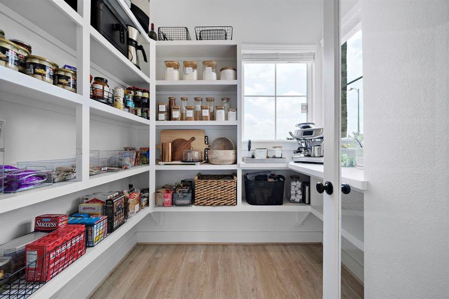 Fantastic walk-in pantry offering ample storage and a well-appointed coffee station.