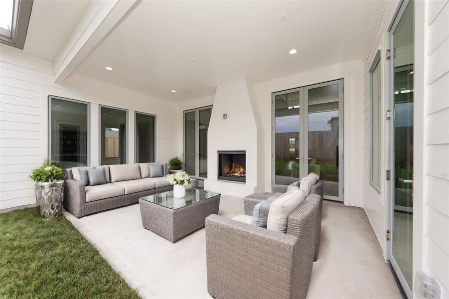 Entertain with the covered patio and double sided fireplace