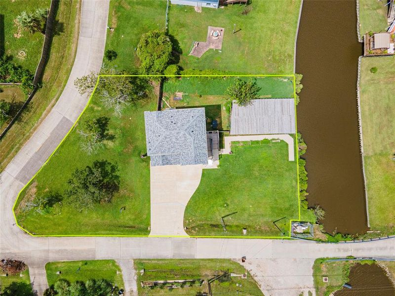 A charming sidewalk leads to Gum Bayou, providing easy access to serene waters and nature.