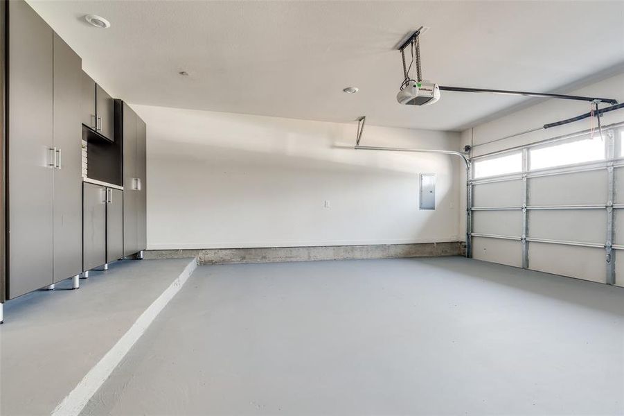 Garage with Expoxy Floor and Custom Cabinets