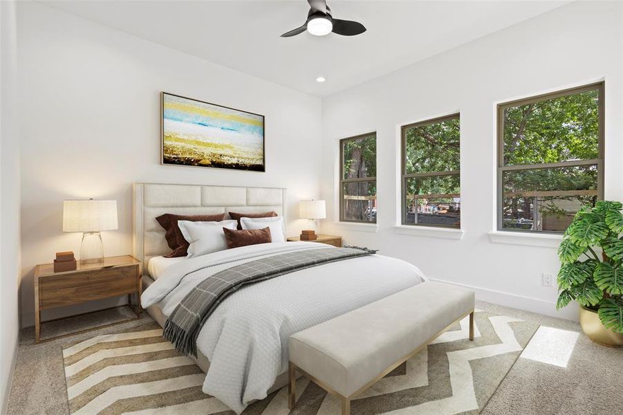 Carpeted bedroom featuring ceiling fan