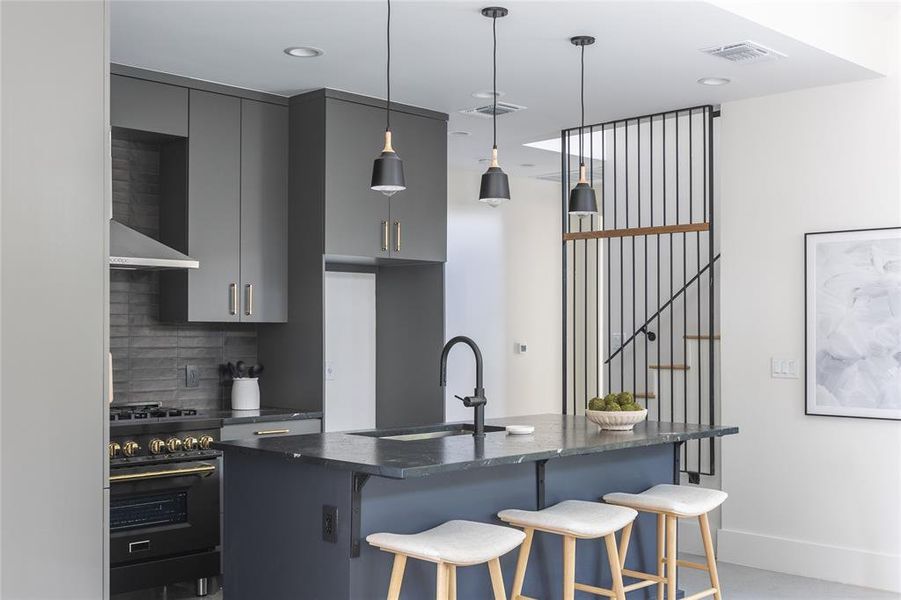 Generous kitchen island with seating and custom cabinetry maximizes storage.