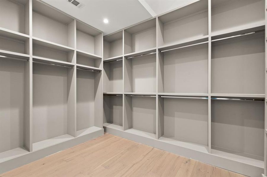 Built in closet in the Prestigious Primary Suite offers an abundance of storage and hanging space including off season storage on top.