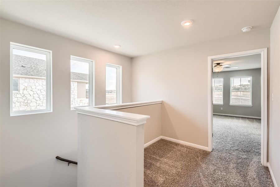 There's a cozy loft area in front of the secondary bedroom that is perfect for fitness equipment, a study area, and more.