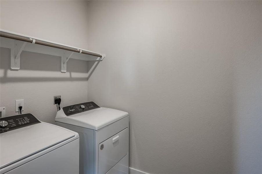 Laundry room with brand new washer/dryer.
