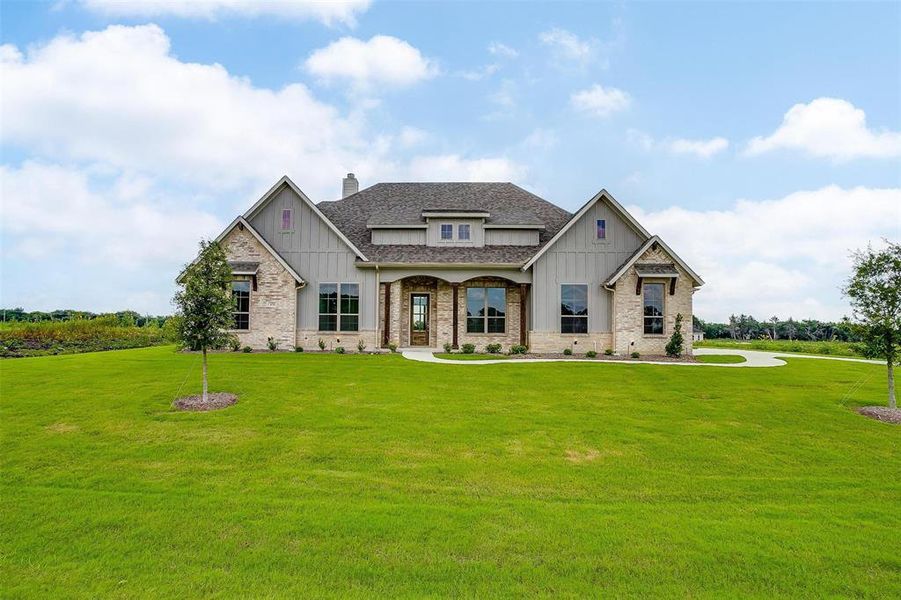 Craftsman-style home featuring a front lawn