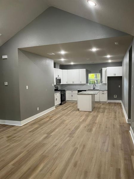 Open concept, kitchen overlooks living/dining area