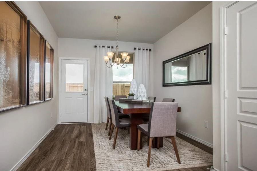 Photo of Pulte model home with same floor plan, not of actual home listed.