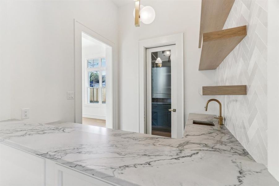 The wetbar and wine room also flow directly into the dining room (door to the left) for easy access during dinner parties.