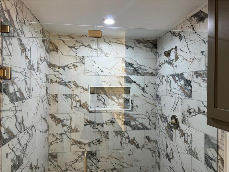 Bathroom with a tile shower