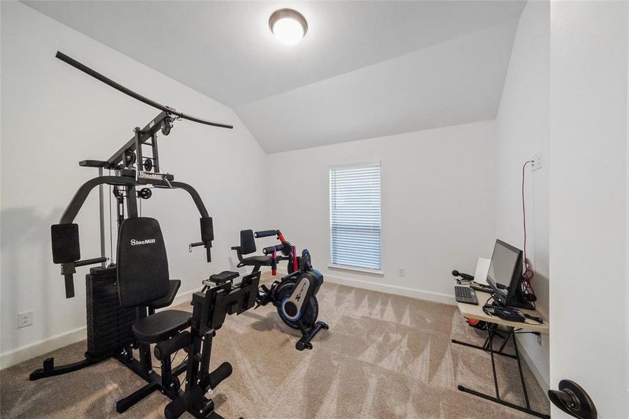 This guest bedroom is currently being used as an exercise room.