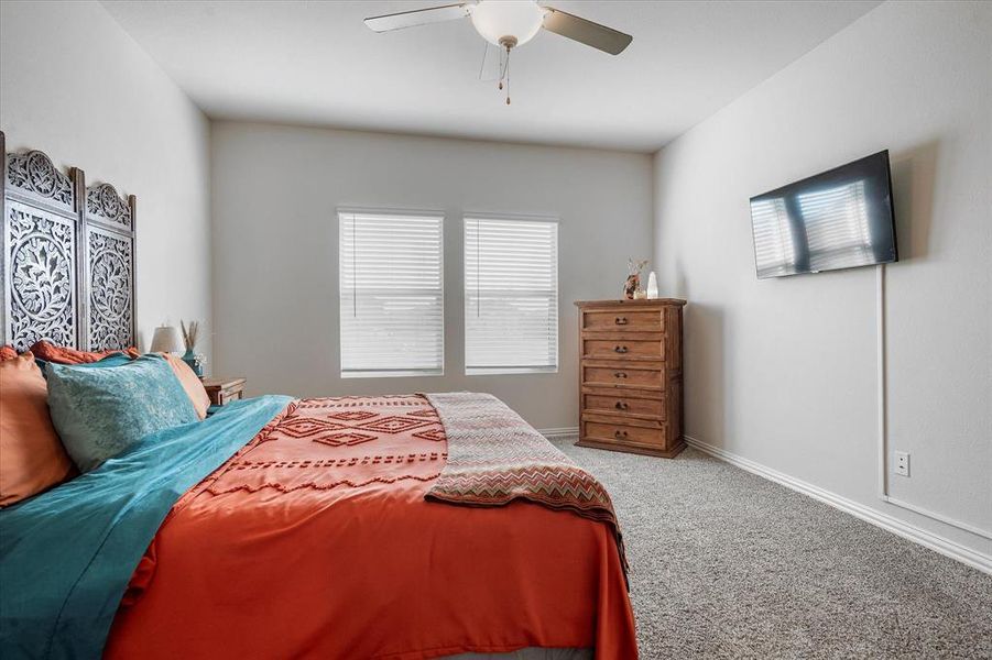 Bedroom with carpet and ceiling fan