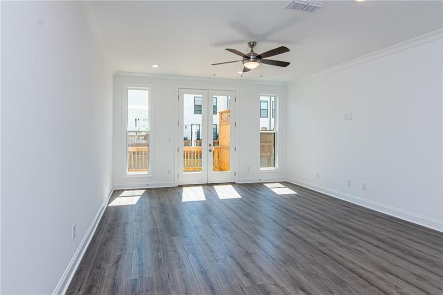 Living Room with natural light and Wooden Deck . Not the actual unit previously built