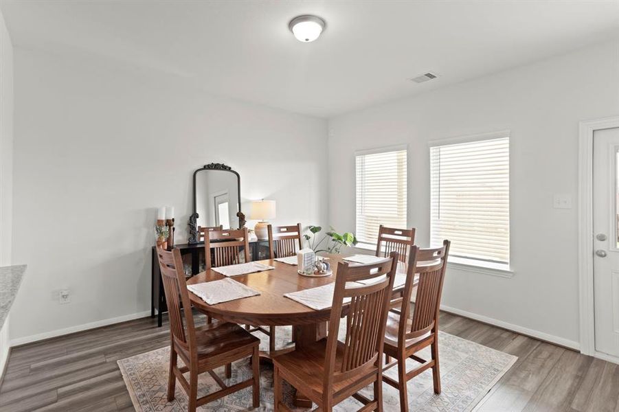 Versatile dining area with easy access to the outdoors, perfect for entertaining or relaxing as a cozy living space.