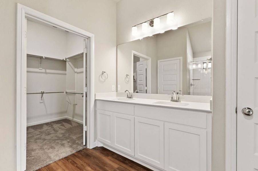 Primary Bathroom in the Quartz home plan by Trophy Signature Homes – REPRESENTATIVE PHOTO