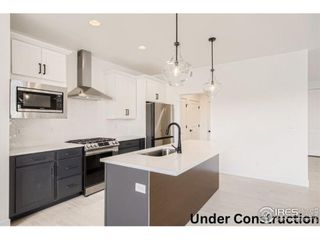 New construction Duplex house 477 Red Jewel Dr, Windsor, CO 80550 Palisade - photo 1